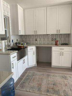 Tiling, flooring and cabinetry remodel.