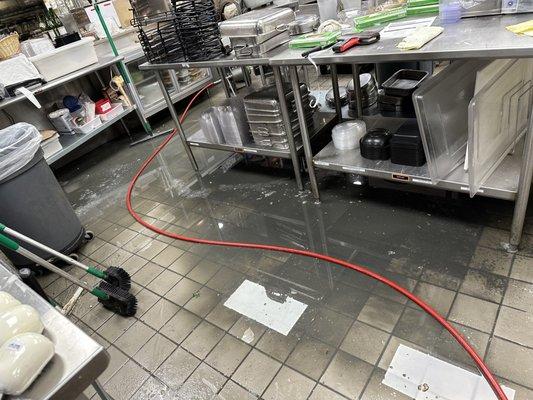 Hydro-jetting emergency backup inside grocery store.