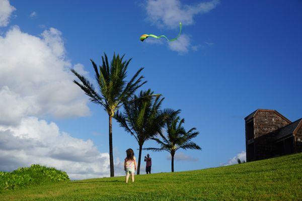 C-8 is seen on the right. We would sit down at the benches to watch the sunrise/set. Here is my daughter flying a kite with her dad.