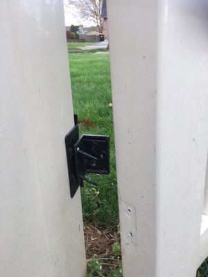 Gate door broken off gate hinges.