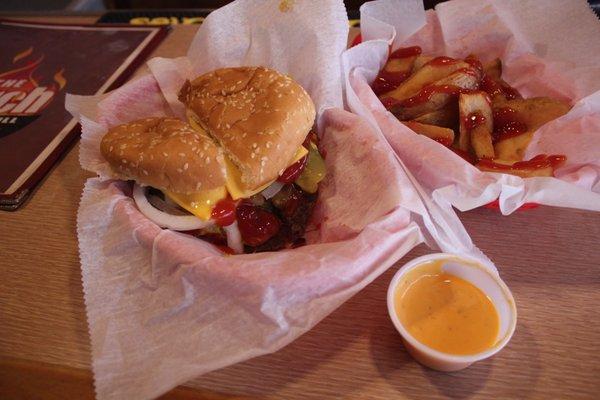 Torch Burger with Cheese and everything on it. Cup of Boom Boom sauce on the side.