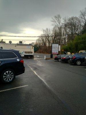 Not a great picture in order to get a picture of the front you have to stand in the road. This is the strip mall Speedy Mart is located in.