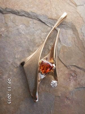 Pendant with Spessartite garnet center and diamond accent