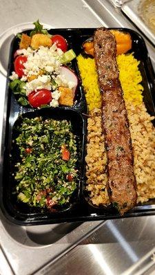 This is the lamb kebob, grilled fresh and served over rice or bulgur wheat, with your choice of 2 side salads