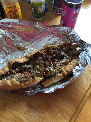 Large cheesesteak with peppers and onions.