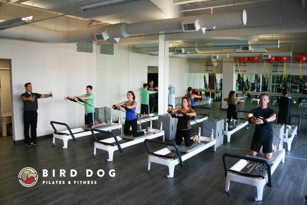 Wes teaching a Pilates Reformer class.