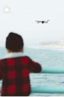 A little boy learning about drones.