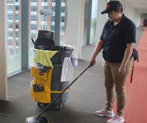 REDLEE/SCS employee cleaning carpet at a commercial building in Dallas, Texas.