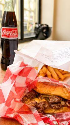 Double cheeseburger, fries, and a Coke