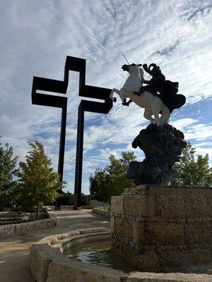 Empty cross and sculpture