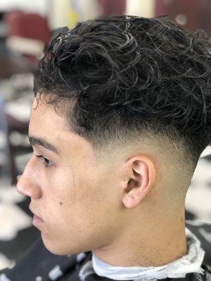 Low bald fade curly on top