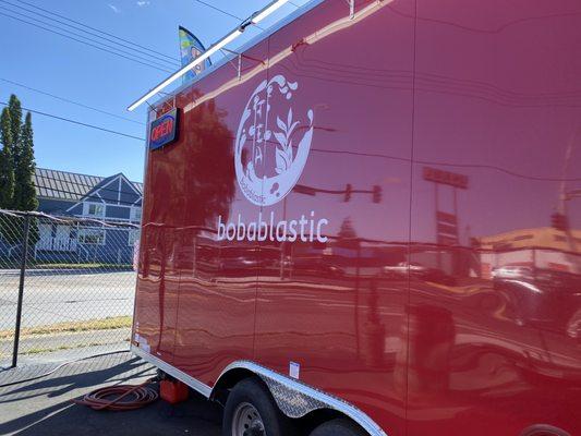 Side of food truck with open sign