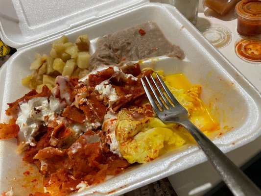 Red Chilaquiles with sunny side up egg.