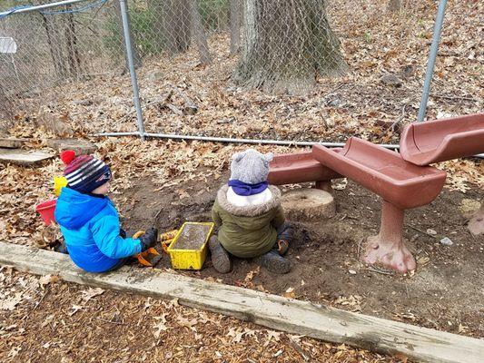 Working together to build a pool at the end of the riverbed.