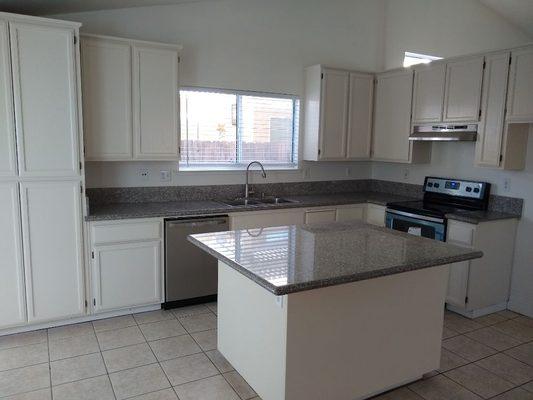 Painted cabinets and installed appliances.