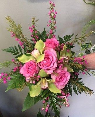 For Prom, a colorful clutch bouquet with roses and cymbidium orchids