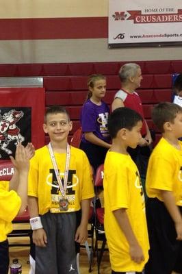 Joey receiving his Medal for basketball