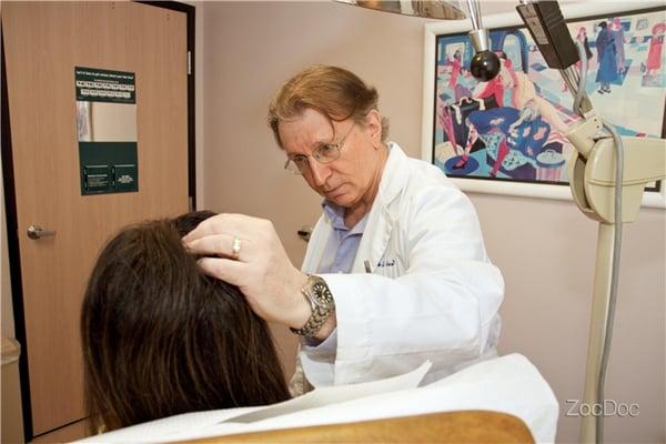 Dr. Kranson examines a patient.