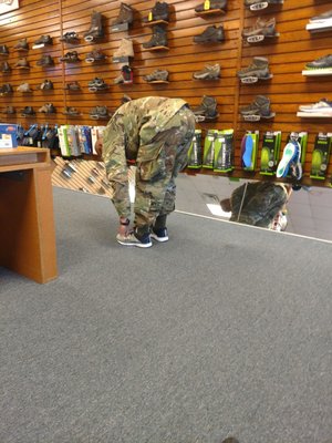 My husband trying on some new Asics.