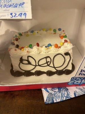 Bought an ice cream cake. It looks like a 3 year old decorated the front of it. Very bizarre??