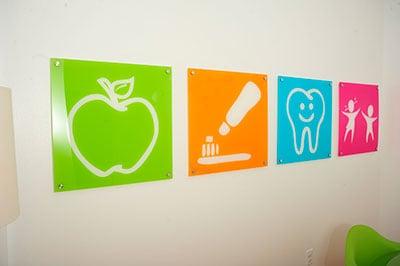 Custom art lines the walls.  Central Arkansas Pediatric Dentistry in Sherwood, AR.