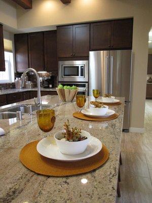 Island dining in kitchen of staged home.