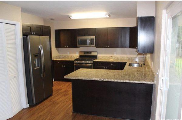 Dark chocolate cabinets with accented granite counter tops!