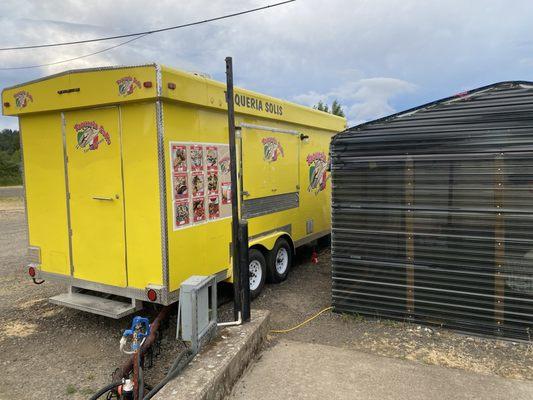 Food truck and a few sit down tables