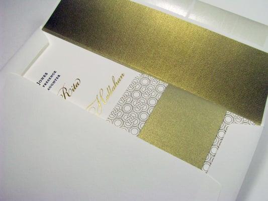 Gold foil stamp and letterpress invitation with hand painted edges with matching liner and belly bands.