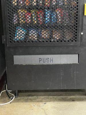 One of the workers was trying to get free food and soda from this filthy machine. It doesn't work so the items are outdated.