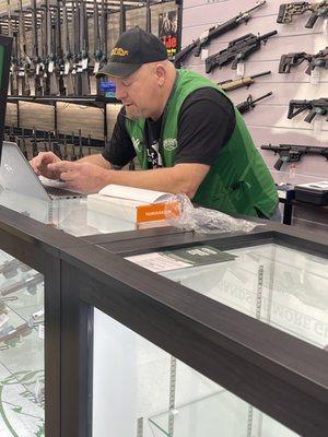 Works at gun counter at Sportsmans wearhouse