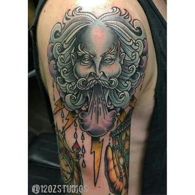 Gloomy old man wind shoulder tattoo by Chris Curtis.