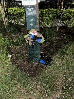 Overflowing, fowl smelling dog waste bin