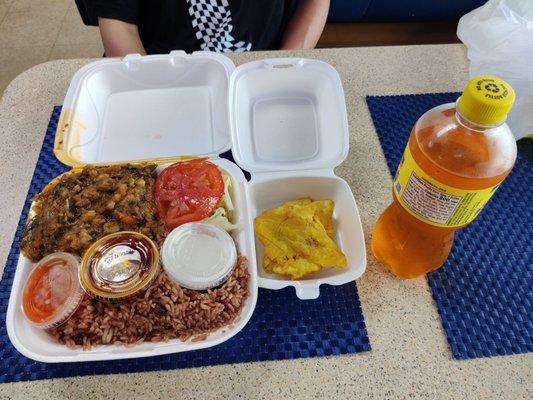 Fried plantains, legumes with beef, rice and beans, spicy pickles, salad, and a tropical fruit soda. It was really filling and delicious.