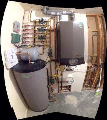 Retrofit of an old peerless boiler and simple water heater to very high efficiency equipment.