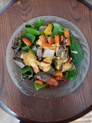 Homemade romesco dressing with fresh roasted veggies and beef salad