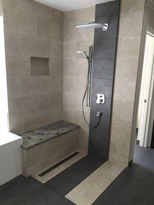 Shower without glass.  No curb and linear drain.