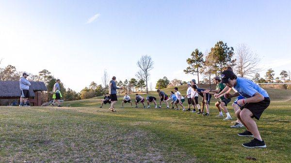 Antidote works with running clubs, golf teams, youth sports, and elite athletes. Here, an ice hockey team learns gravity line maintenance.