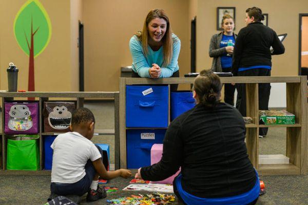 BCBA at work in autism therapy center.