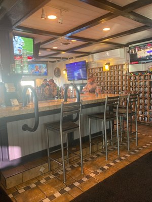 Bar with plenty of tvs and wall for mug club