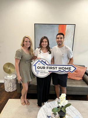 Brena Berrios with first time homebuyers closing on their new home.