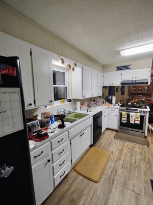 Wooden kitchen cabinets and paneling after painting