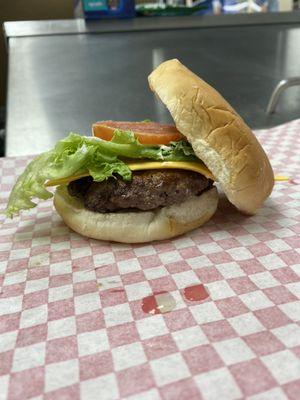 This burger contains our freshly toasted buns and fresh lettuce and tomato all on top of our juicy beef patty