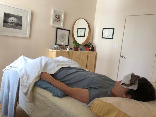 Our healing space is light-filled and calming. The treatment table features an BioMat Amethyst mat for added rest and restoration.