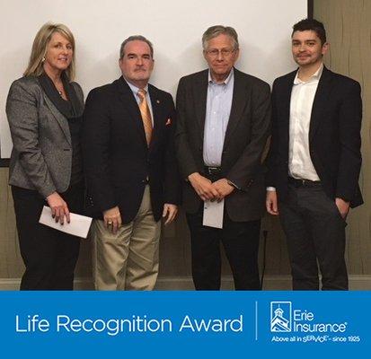 Stroud-Miller Insurance Services in Wilkesboro, North Carolina accepts the Bronze Life Recognition Award from Erie Insurance. 336-667-9238