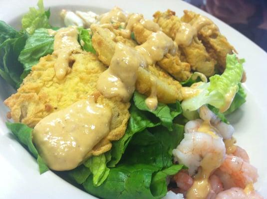 Fried green tomato salad with boiled shrimp and lump crab, topped with remoulade!