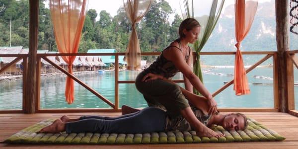 Sunny demonstrating a basic Thai Yoga Massage technique during a workshop in southern Thailand.