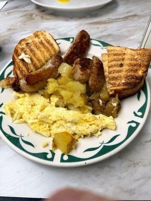 Scrambled eggs, home fries, toast & sausage. Fantastic breakfast!