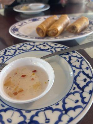 Homemade sweet n sour sauce with spring rolls.