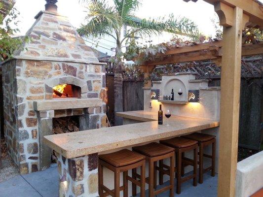 Another outdoor kitchen with a built in fire oven